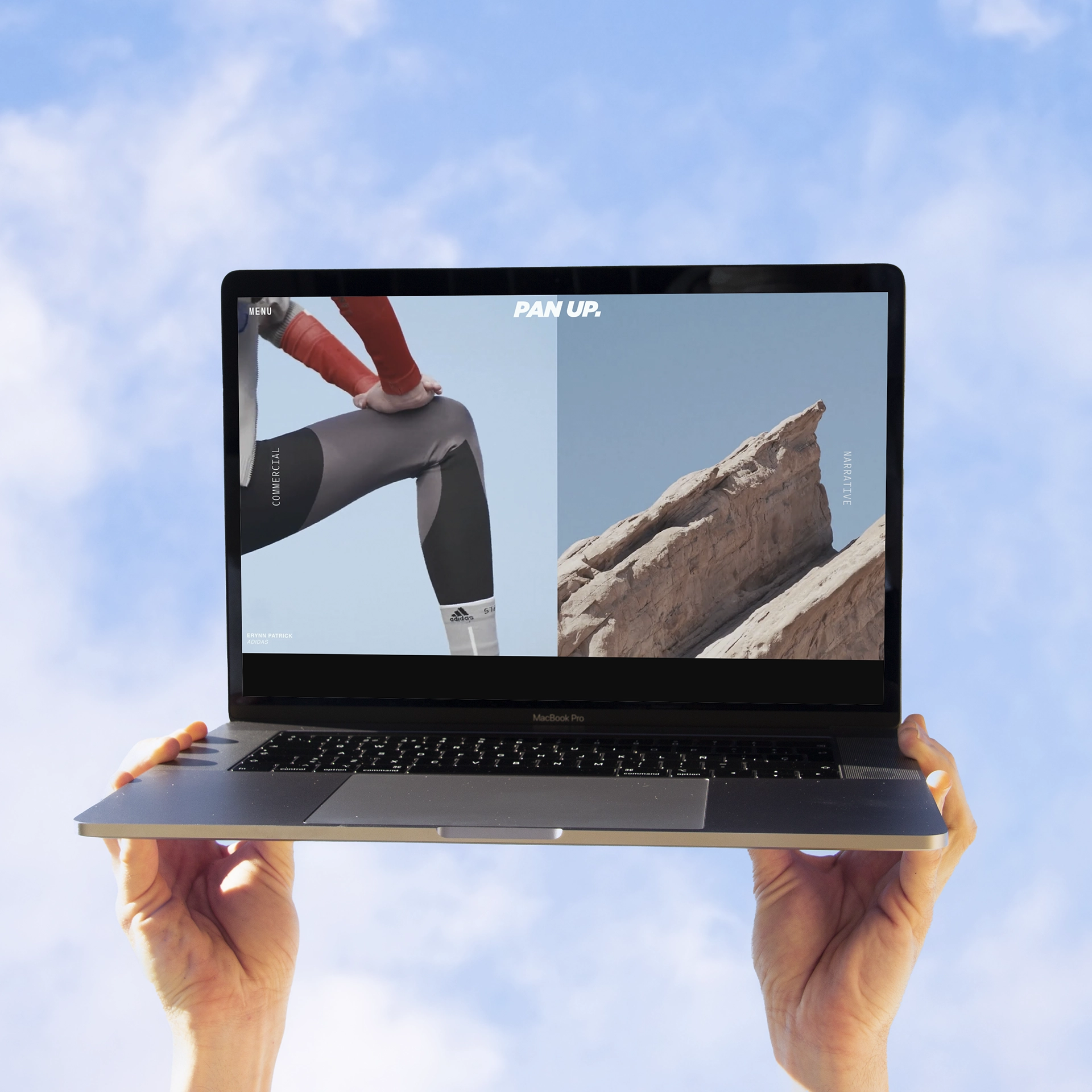 Hands holding mackbook